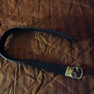 A black/brown Gucci belt  36 inches long